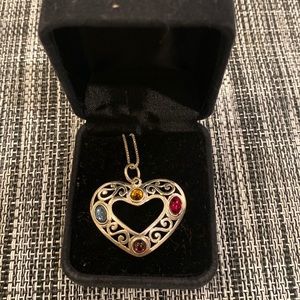 Sterling silver heart pendant with gemstone cabochons. Comes with 24 in chain